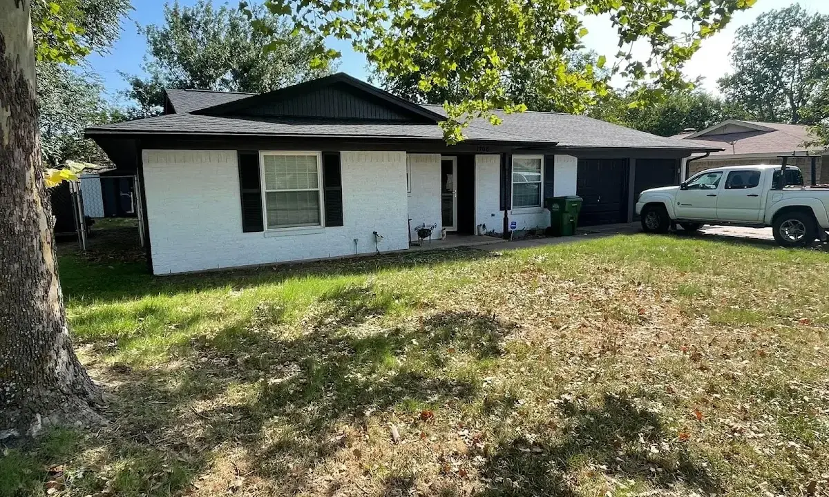 Professional roofing crew working on a residential roof in Manteca
